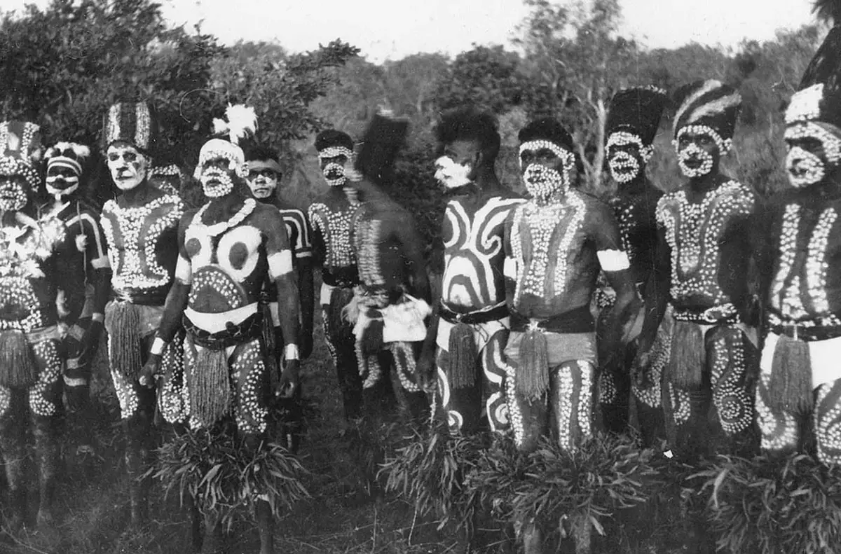 Aboriginal men in ceremonial body paint and headdresses, black and white photograph.