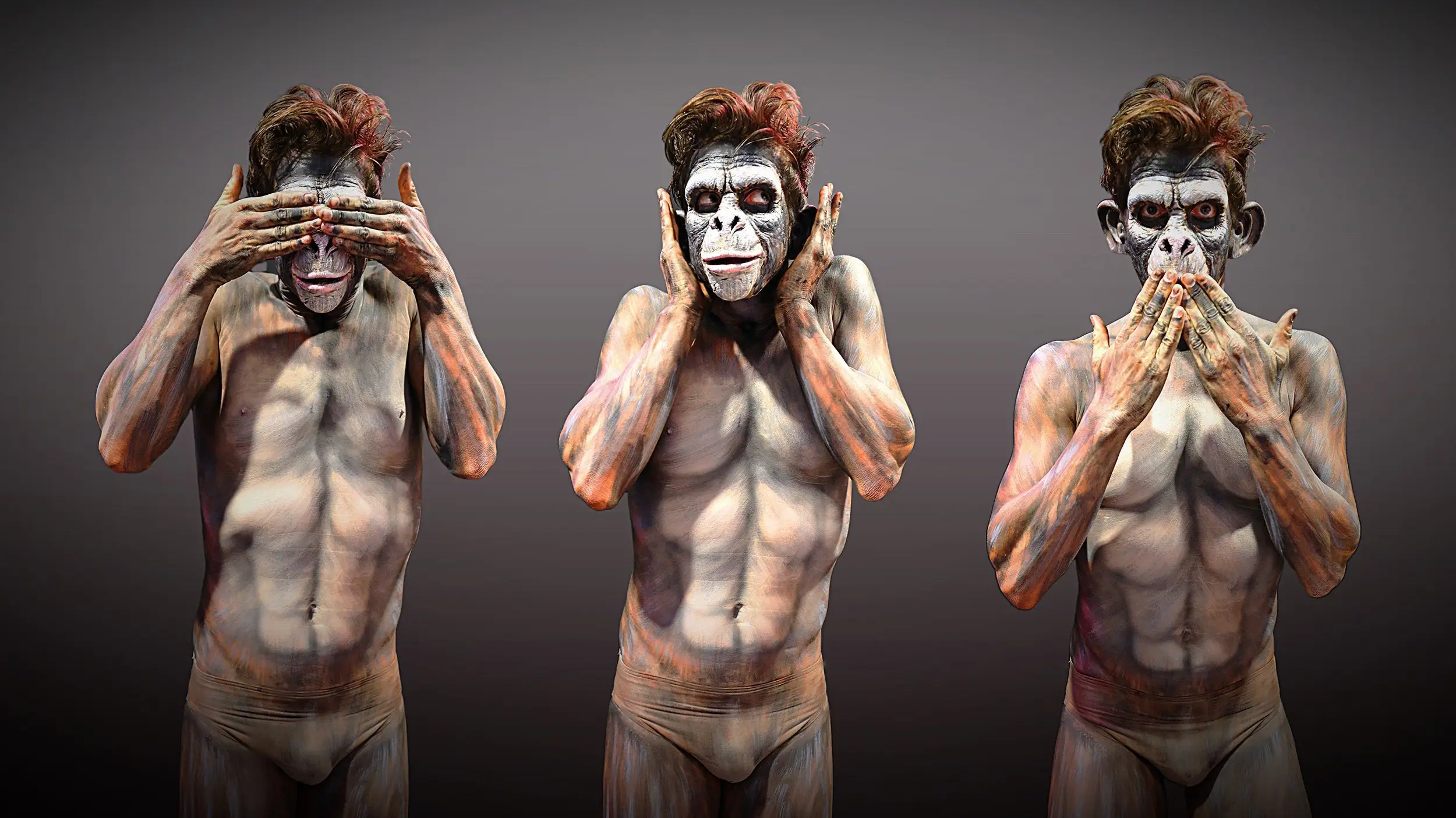 Three body-painted figures in monkey masks, representing see no evil, hear no evil, speak no evil.