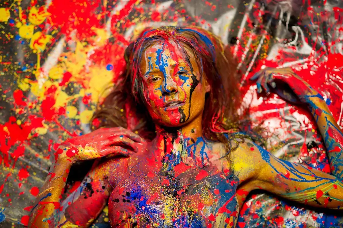 Abstract body paint portrait of a woman, vibrant, expressive, artistic.